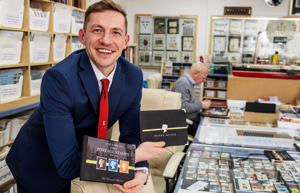 Austin Carroll holding the books.