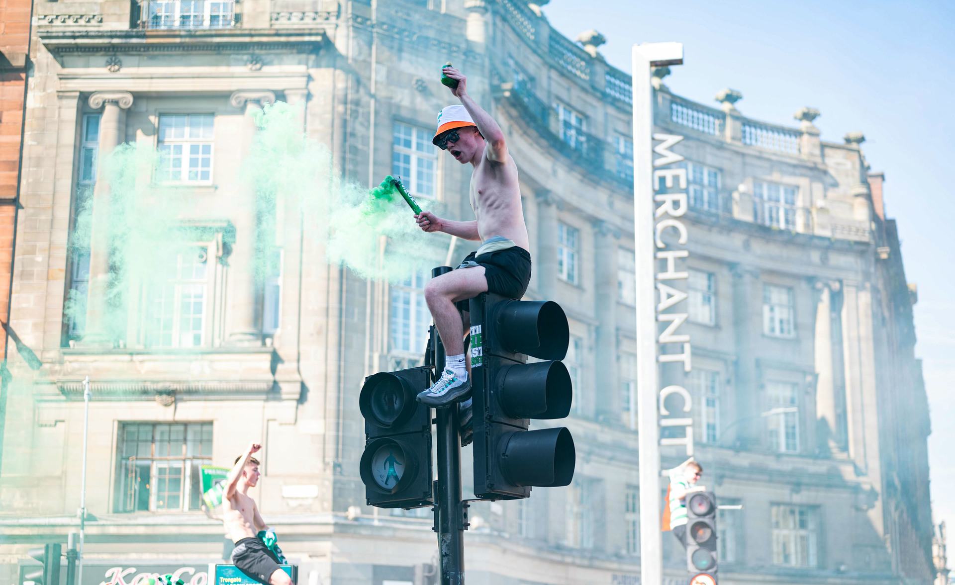 GLASGOW, SCOTLAND - MAY 18: Celtic fans are pictured as they celebrate winning the 2023/24 cinch Premiership title in Merchant City, on May 18, 2024, in Glasgow, Scotland.  (Photo by Ewan Bootman / SNS Group).