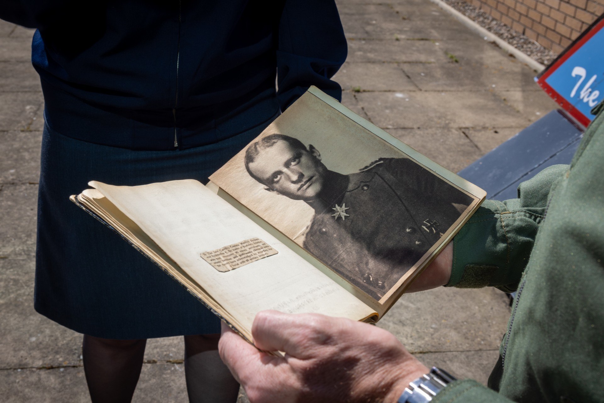 Detail from inside the notebook includes German newspaper clippings.