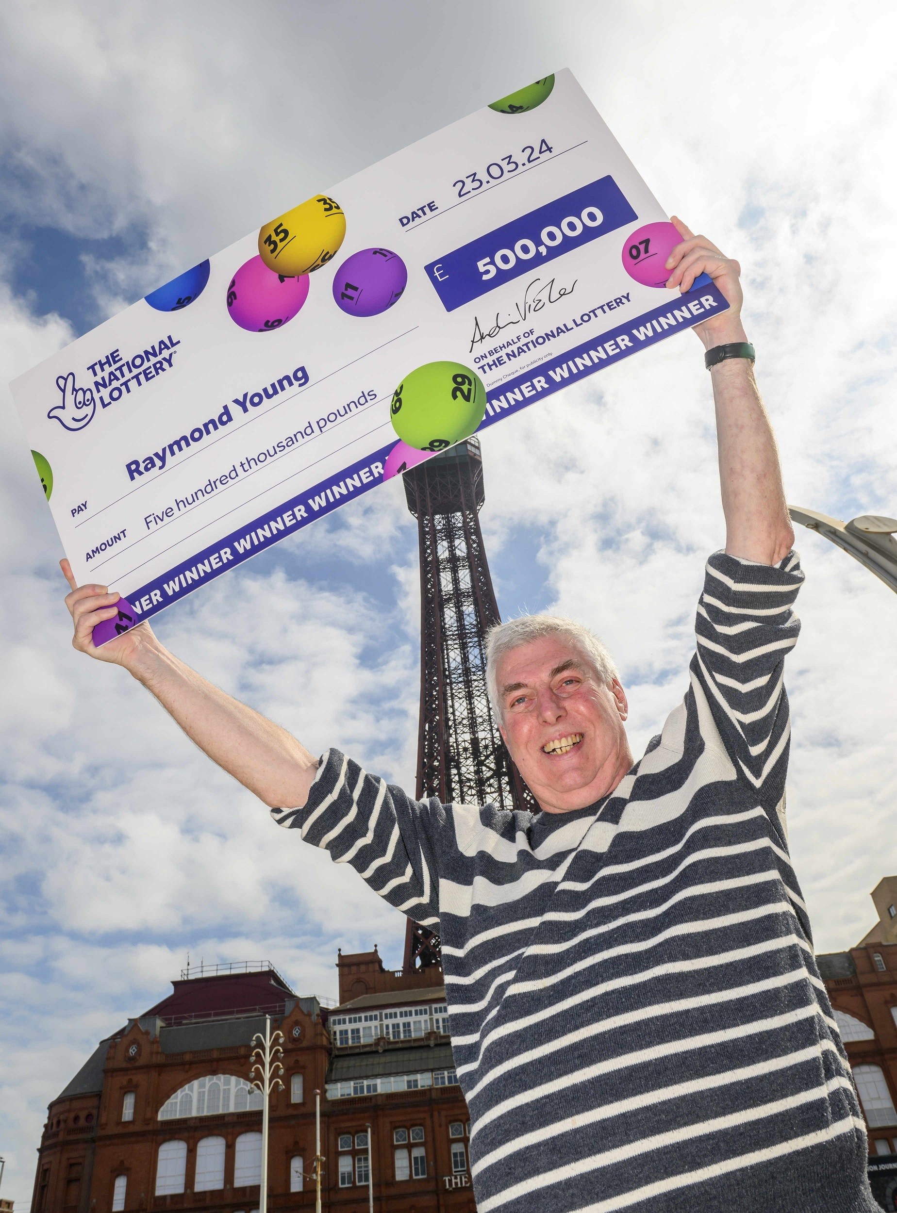 Lottery winner Raymond Young celebrates his win in front of Blackpool Tower, Blackpool, UK. Picture date: Tuesday May 7, 2024. Photo credit should read: Anthony Devlin