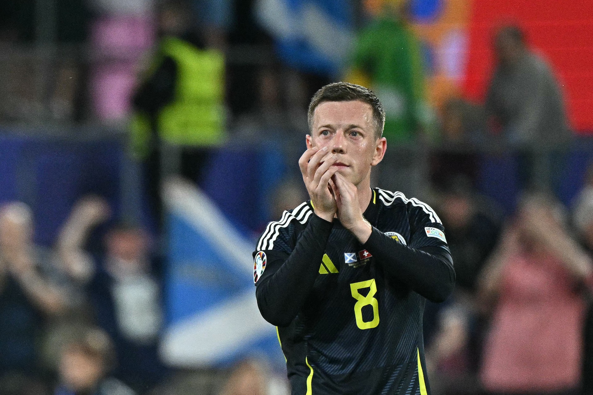 Scotland's midfielder Callum McGregor applauds at the end of the UEFA Euro 2024 Group A football match between Scotland and Switzerland at the Cologne Stadium in Cologne on June 19, 2024.