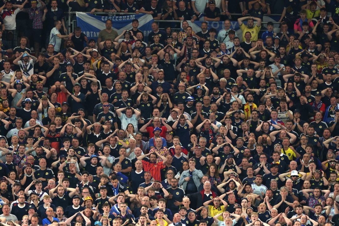 Dejected fans of Scotland after victory is snatched in the 99th minute by Hungary.