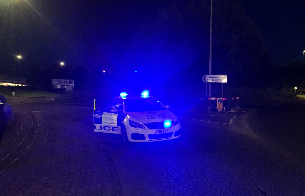 Police at the entrance to Linwood Industrial Estate.