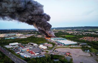 ‘Remain indoors and avoid area’: Explosions and smoke amid fire at battery recycling plant near Glasgow
