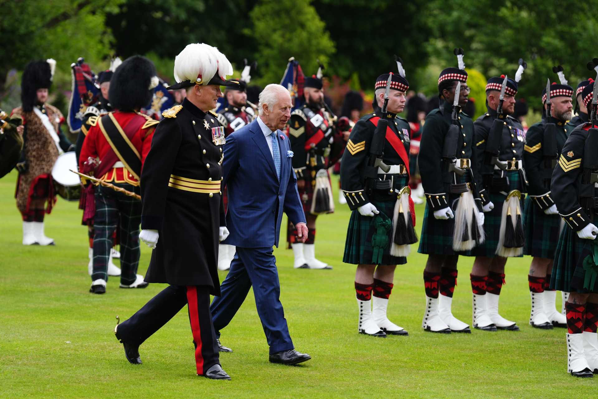 Charles inspects the guard of honour during the Ceremony of the Keys at the Palace of Holyroodhouse (Andrew Milligan/PA) 