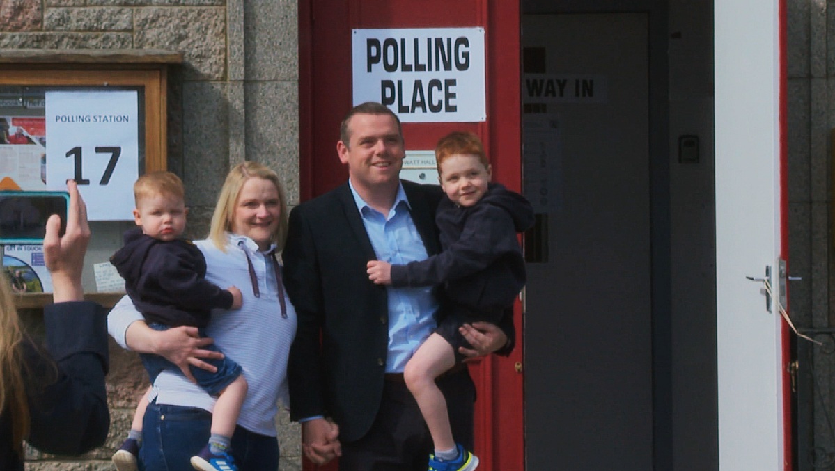 Scottish Tory leader Douglas Ross, his wife Krystle and sons James and Alistair held hands as they walked to the polling station in Fogwatt Hall, Fogwatt, near Elgin in Moray.