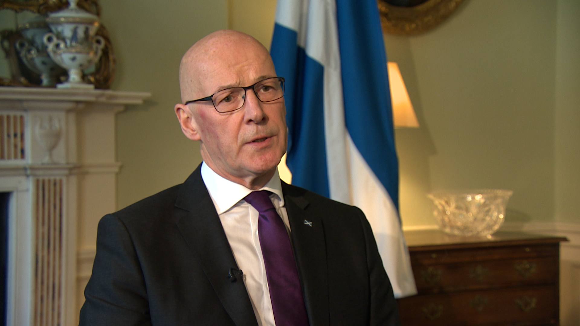 John Swinney says he has delivered a commitment to open five GP walk-in services in the first 100 days of government.