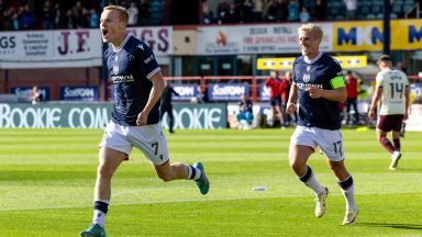 Dundee coast to victory over Hearts to go top of fledgling table