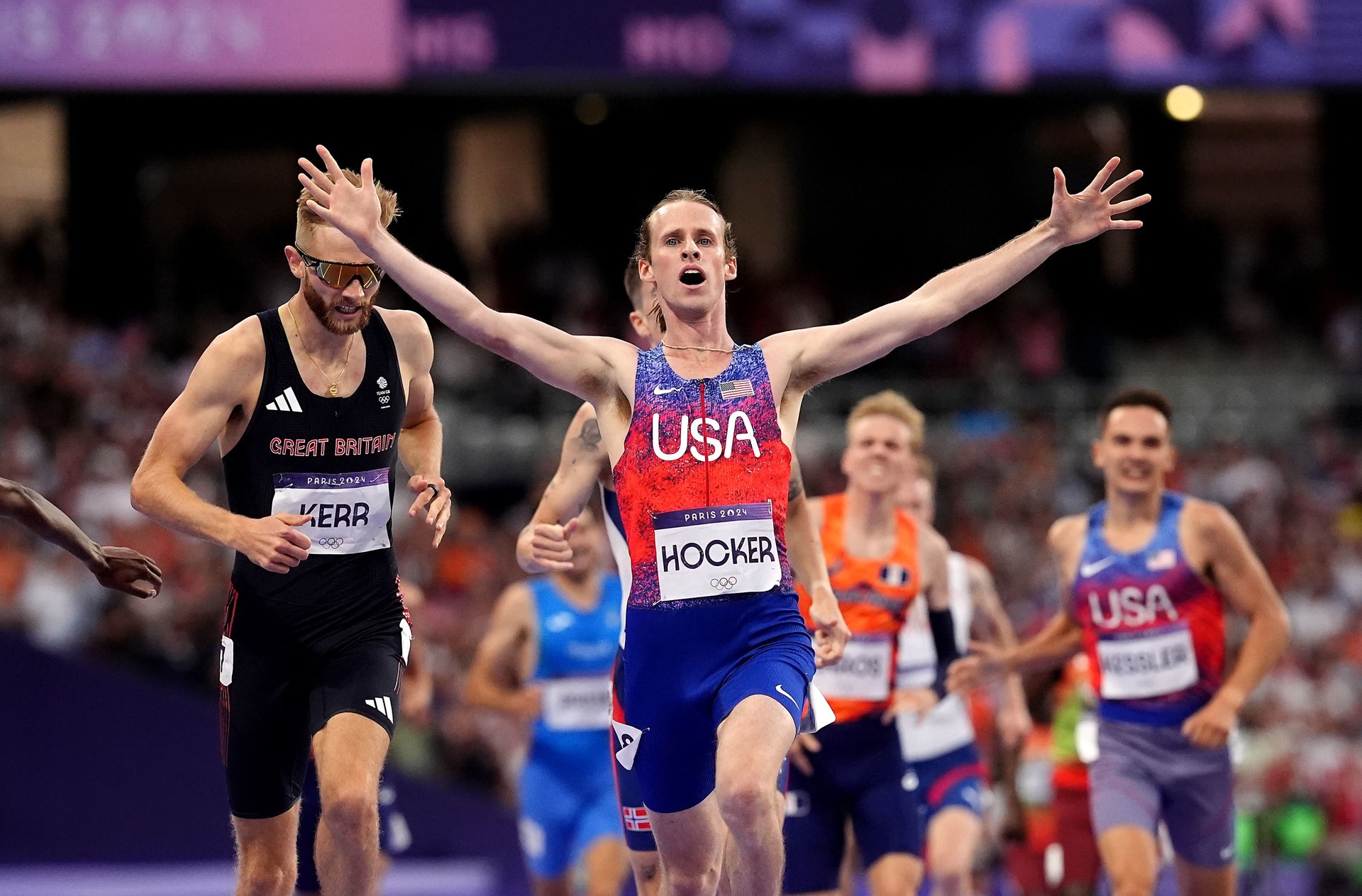 Josh Kerr, left, finishes second as American Cole Hocker celebrates winning the men’s 1500m.