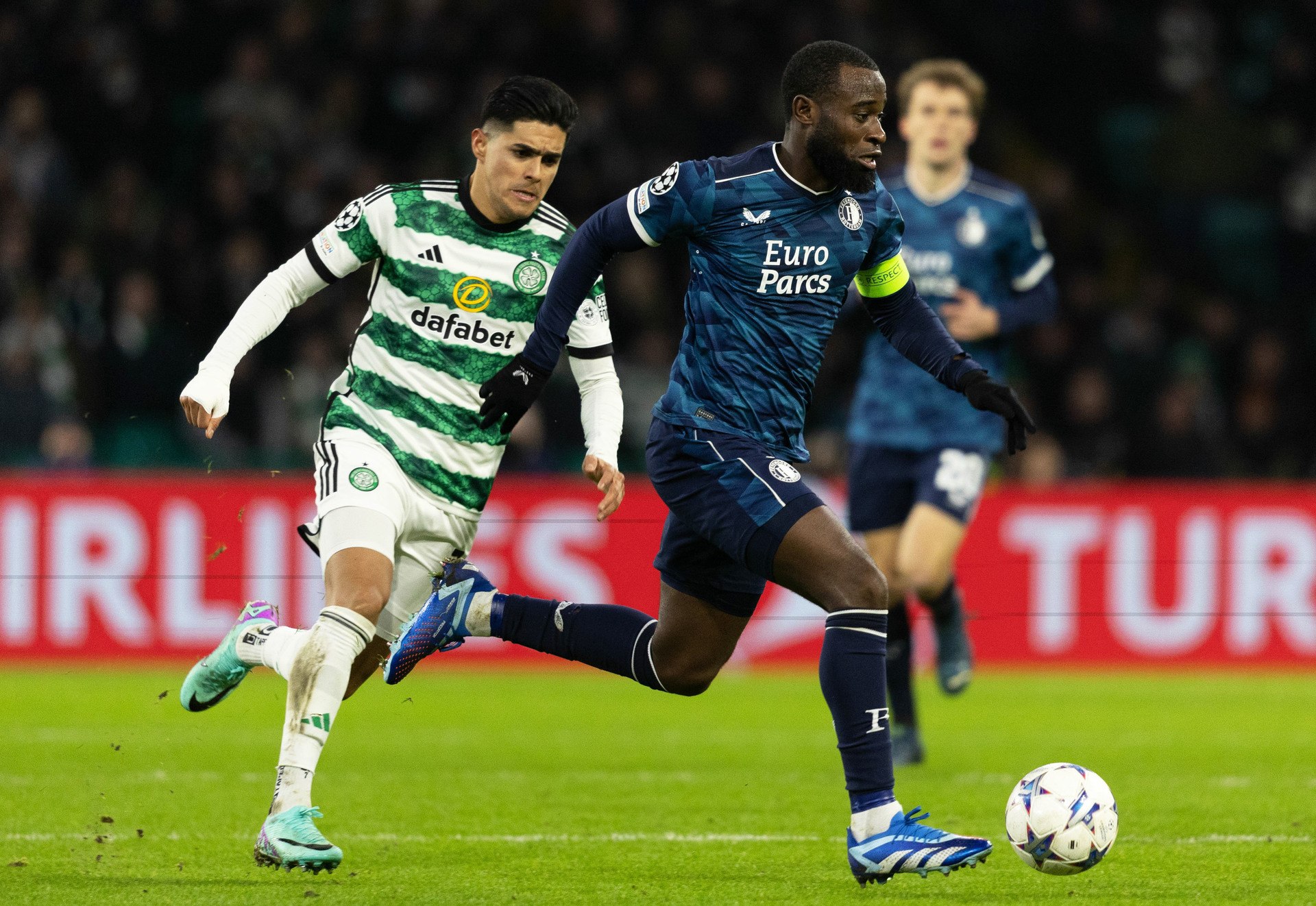 Luis Palma and Feyenoord's Lutsharel Geertruida in action during a UEFA Champions League group stage match between Celtic and Feyenoord at Celtic Park, on December 13, 2023.