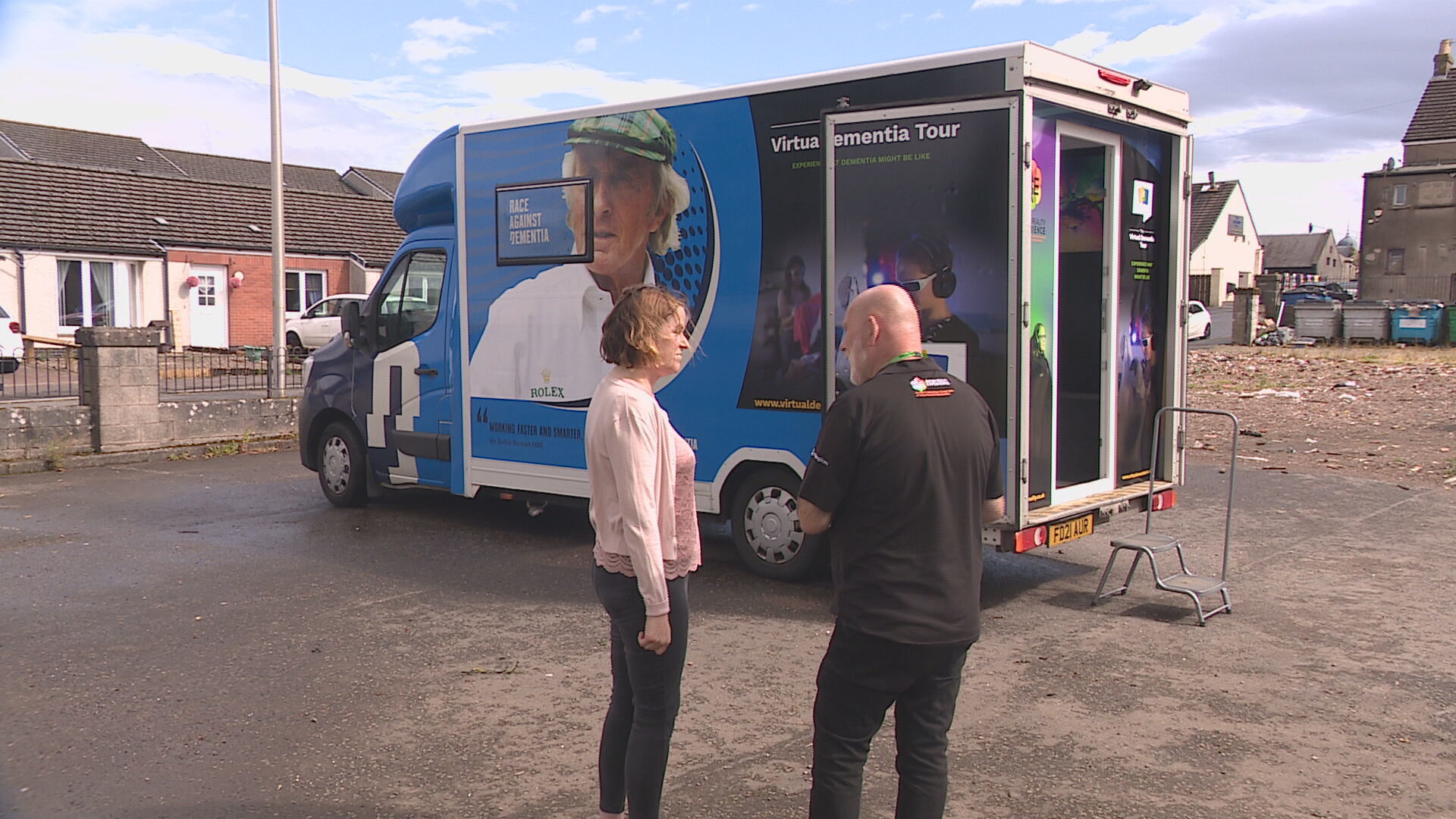 Kirsty Davies with Stewart Holdaway from Training2Care outside the reality experience bus.