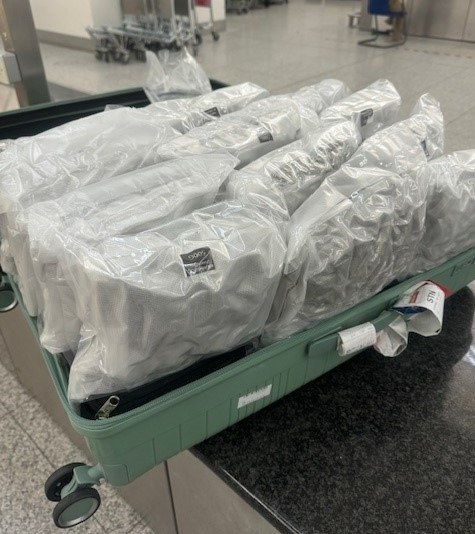 Border Force officers detected around 60kg of cannabis in two suitcases which had arrived on a flight from Bangkok.