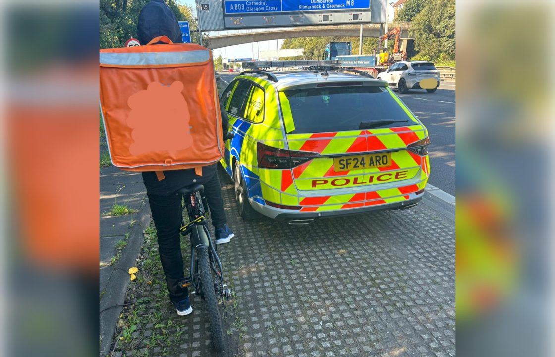 Delivery cyclist ‘in danger’ riding on M8 in Glasgow stopped by police