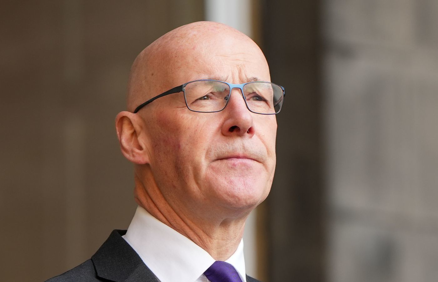 John Swinney said he was forced to cut winter fuel payments after the UK Government cut Holyrood budget.