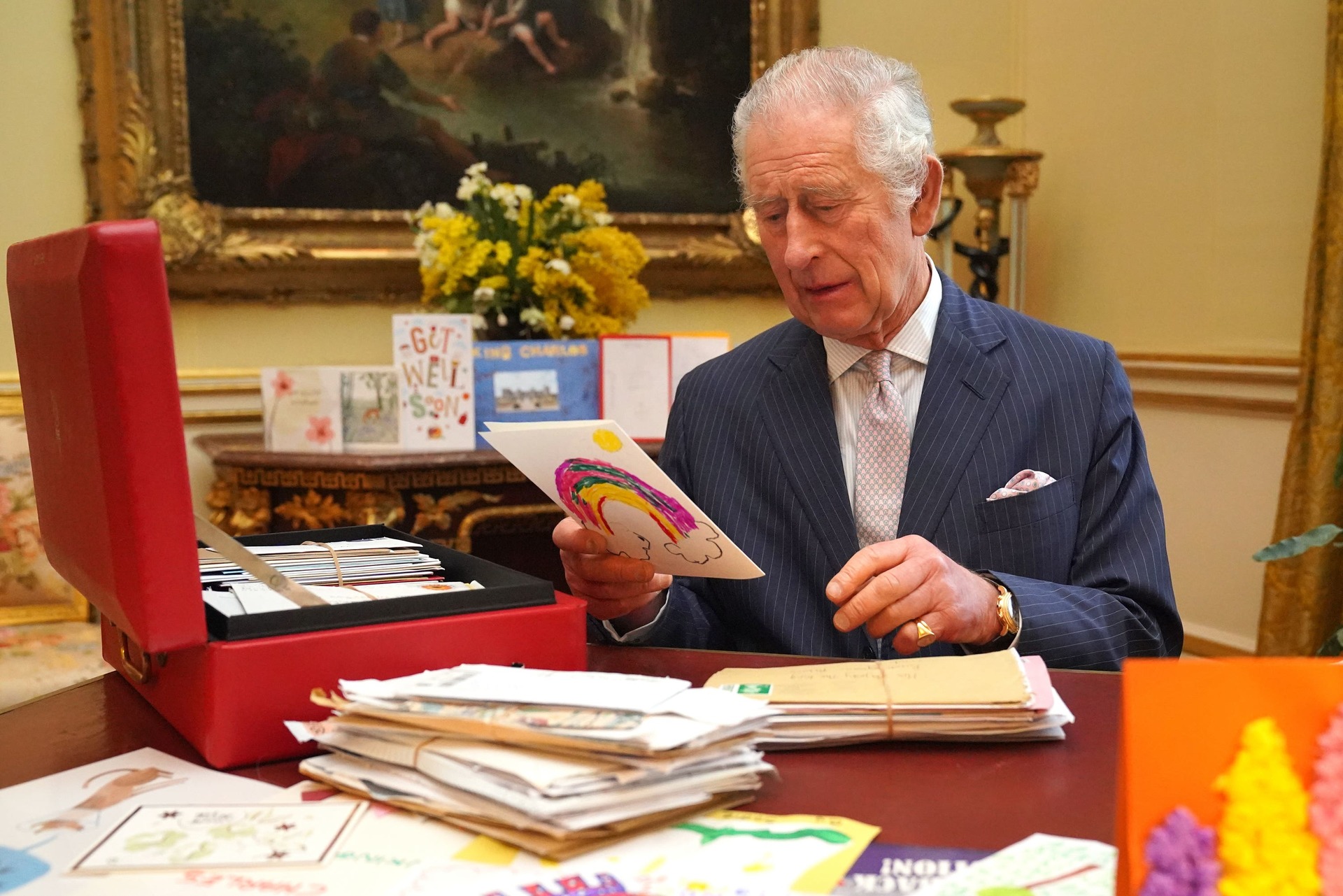 The King in February reading cards and messages, sent by well-wishers following his cancer diagnosis (Jonathan Brady/PA). 