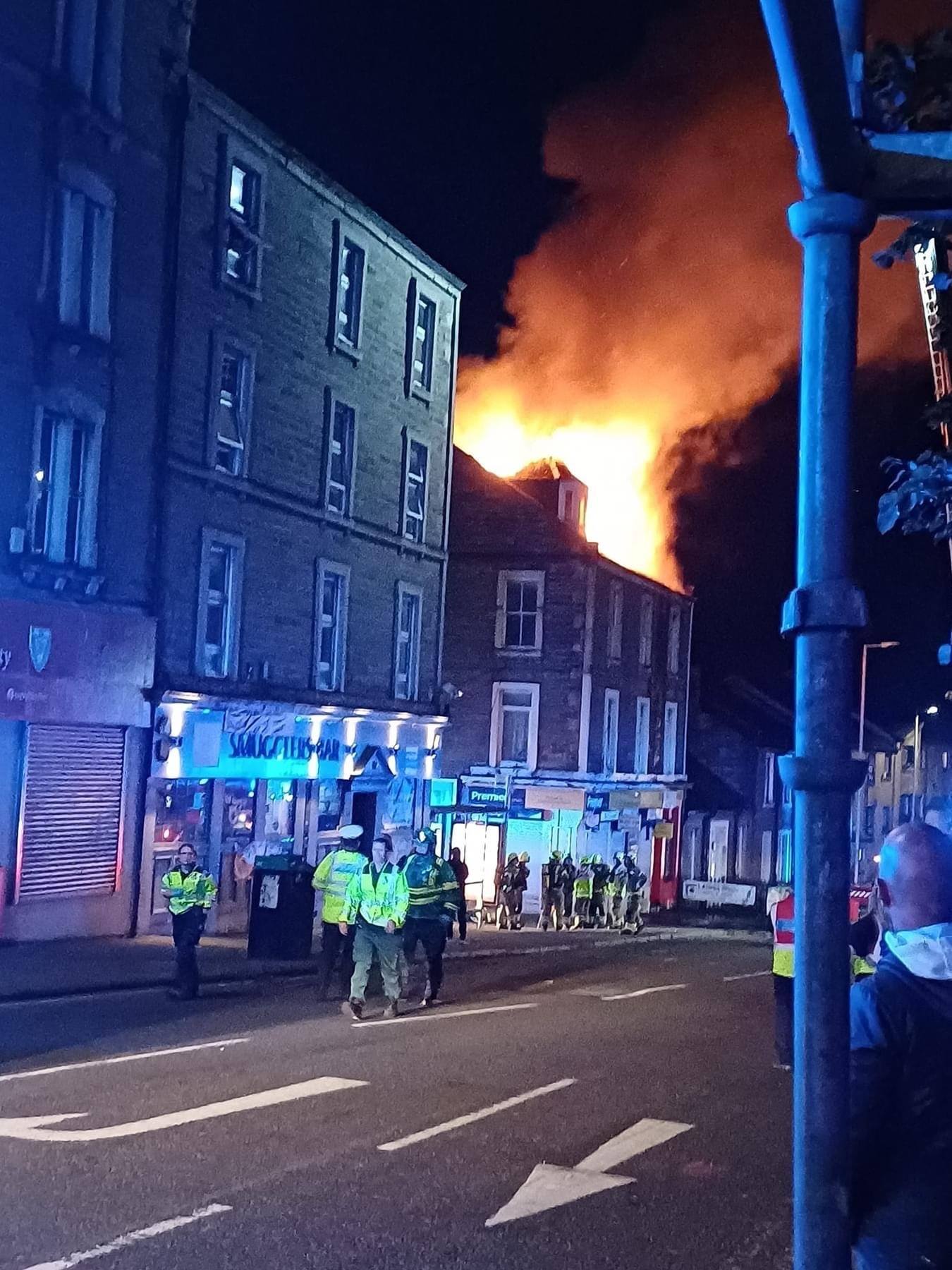 Flames could be seen rising up through the roof of the tenement.