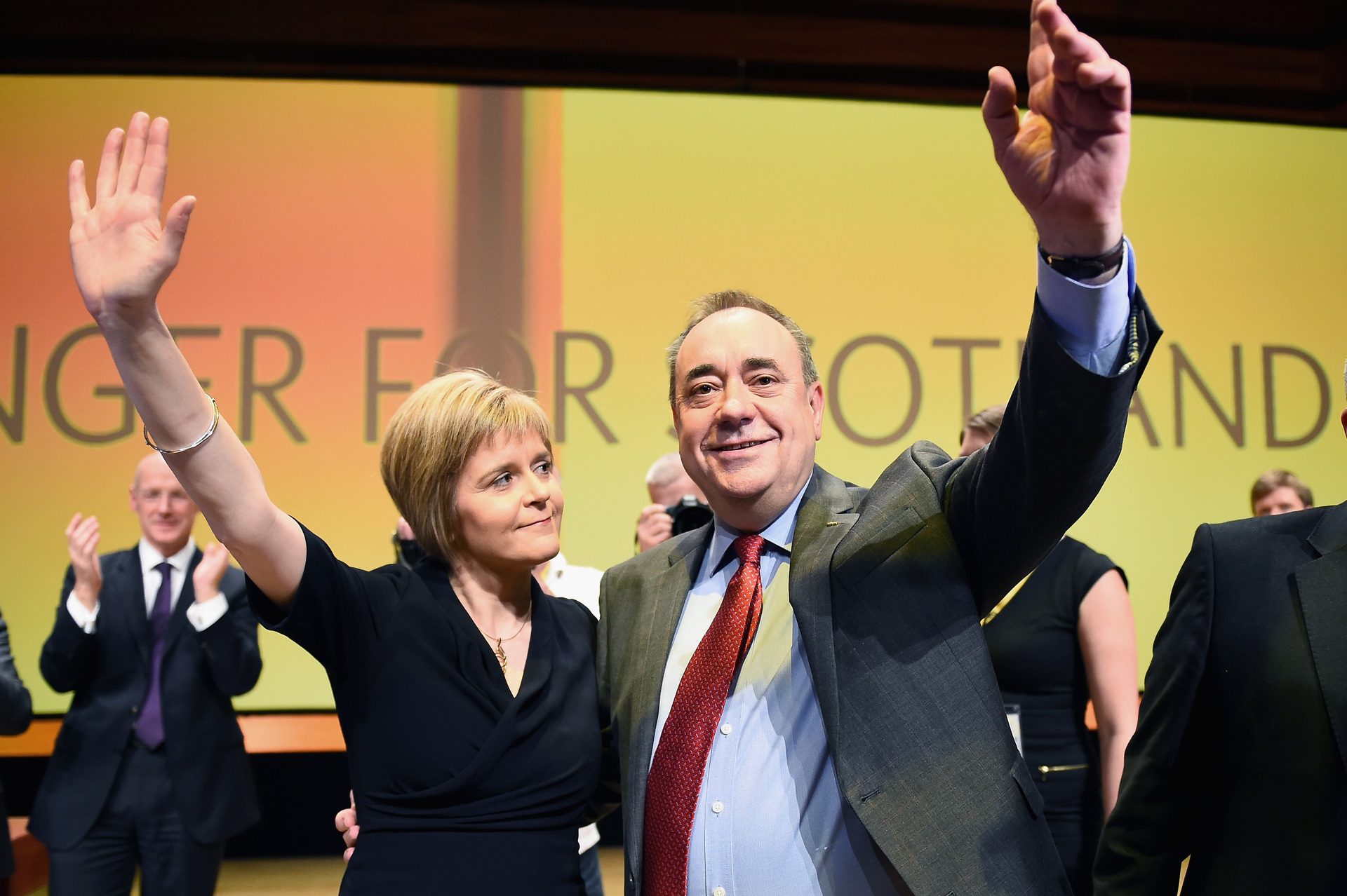 First Minister of Scotland Alex Salmond, acknowledges applause with Nicola Sturgeon following his last key note speech as party leader of the SNP (Getty Images)