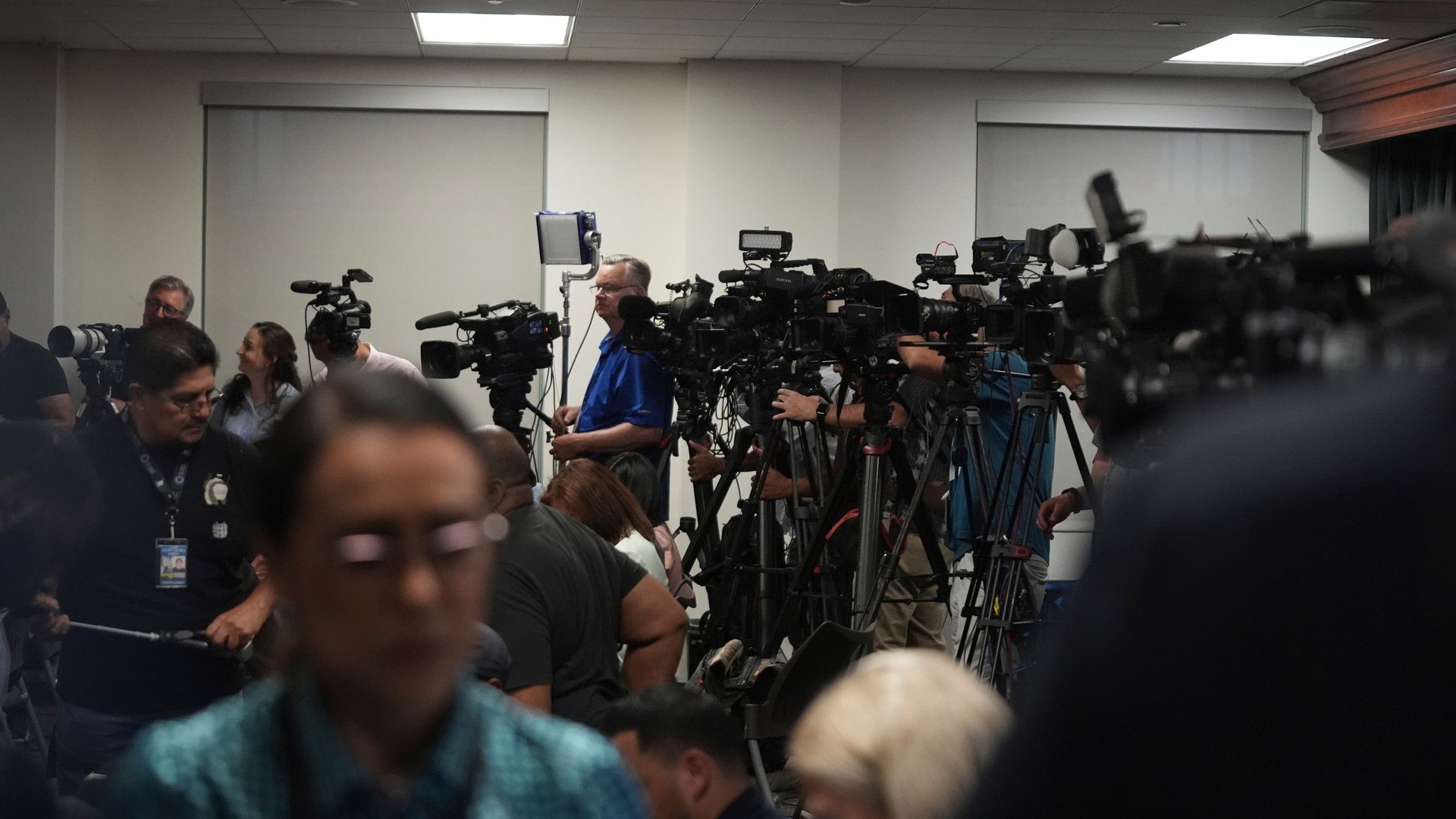 Media gather for a news conference being held by Los Angeles County District Attorney George Gascon