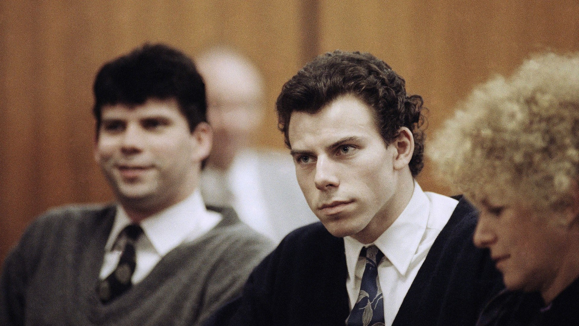 Lyle, left, and Erik Menendez sit with defence lawyer Leslie Abramson, right, during their trial in 1990 