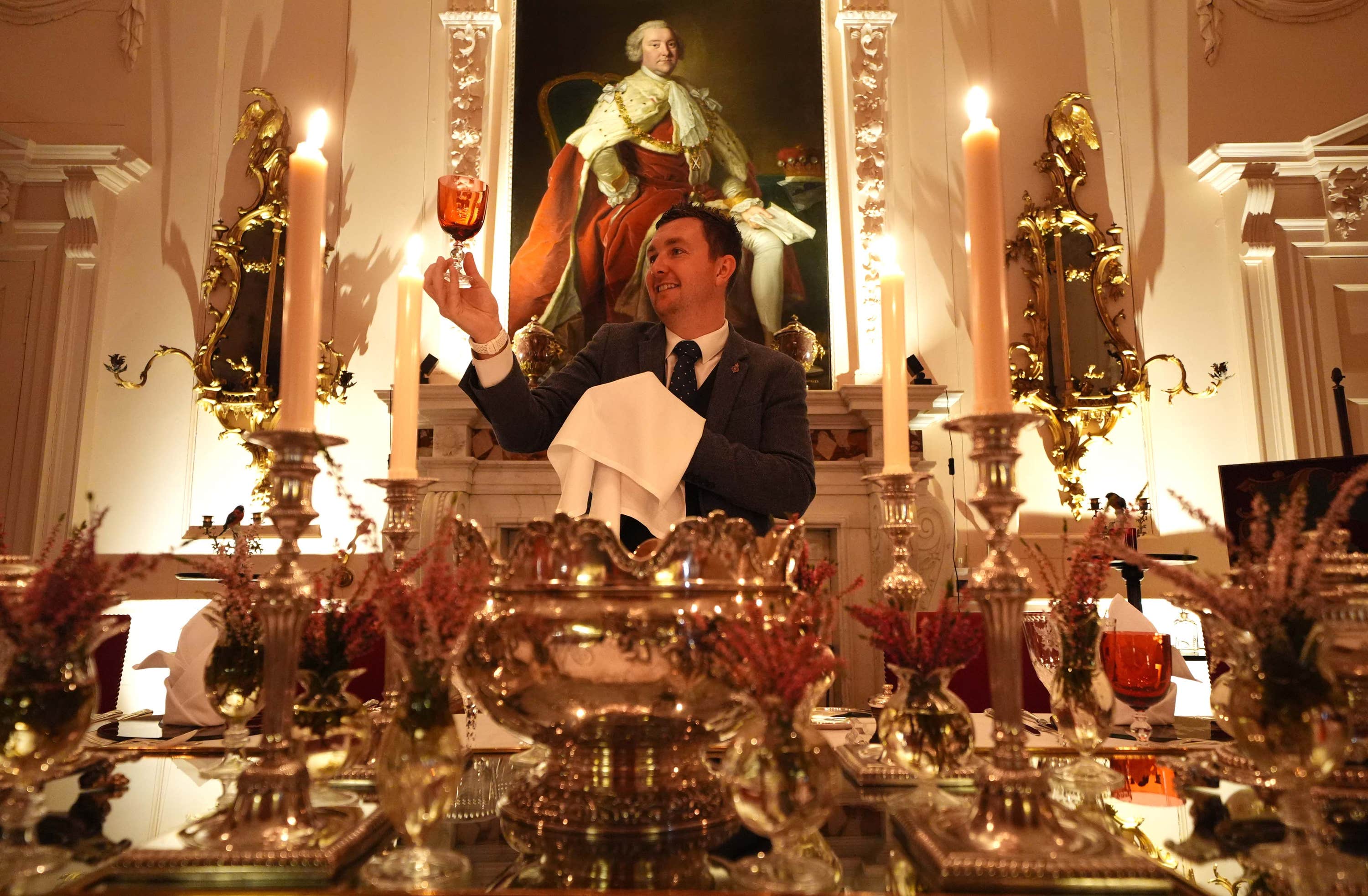 Final checks are made on the glassware as the stage is set for the dinner.