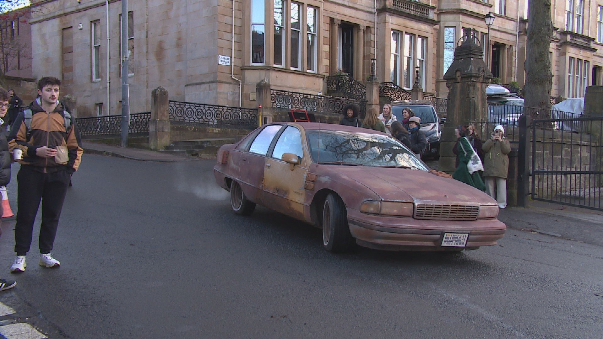 Film crews and rusty cars have taken to the streets of Glasgow