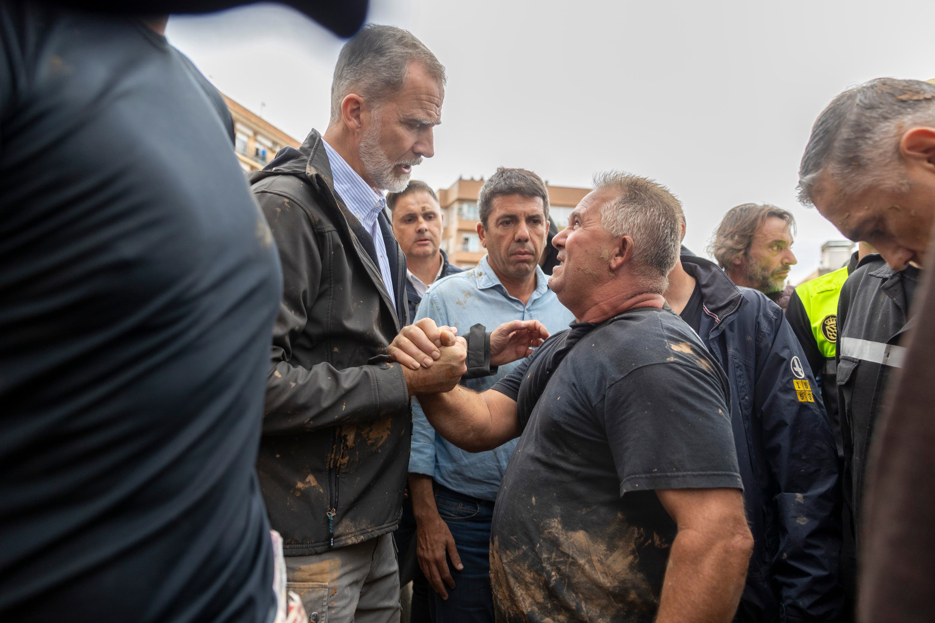 Spain’s King Felipe VI speaks with people in the crowd of angry flood survivors in Paiporta, near Valencia (David Melero/AP) 