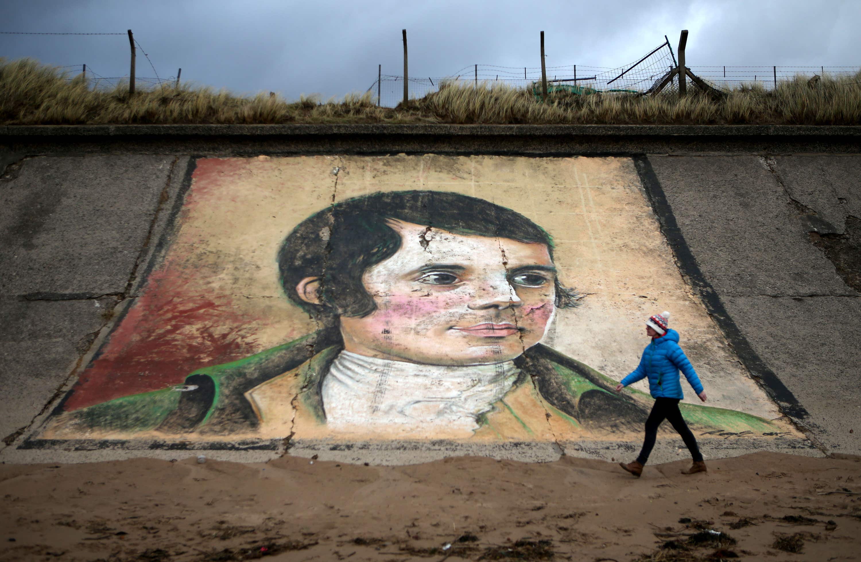 A mural of Robert Burns on the sea wall at Ardeer beach, near his birthplace of Alloway in South Ayrshire (Jane Barlow/PA) 