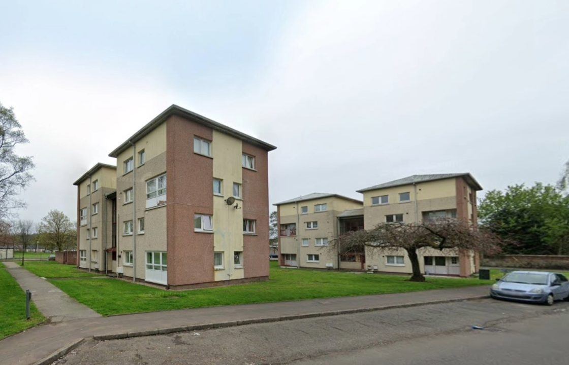 Woman taken to hospital after falling from window at block of flats in Falkirk