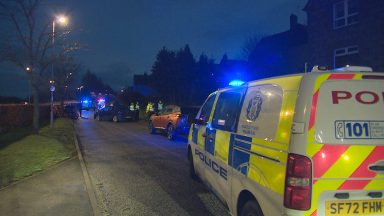 Child, ten, and woman in Aberdeen hospital after two-car crash as man charged