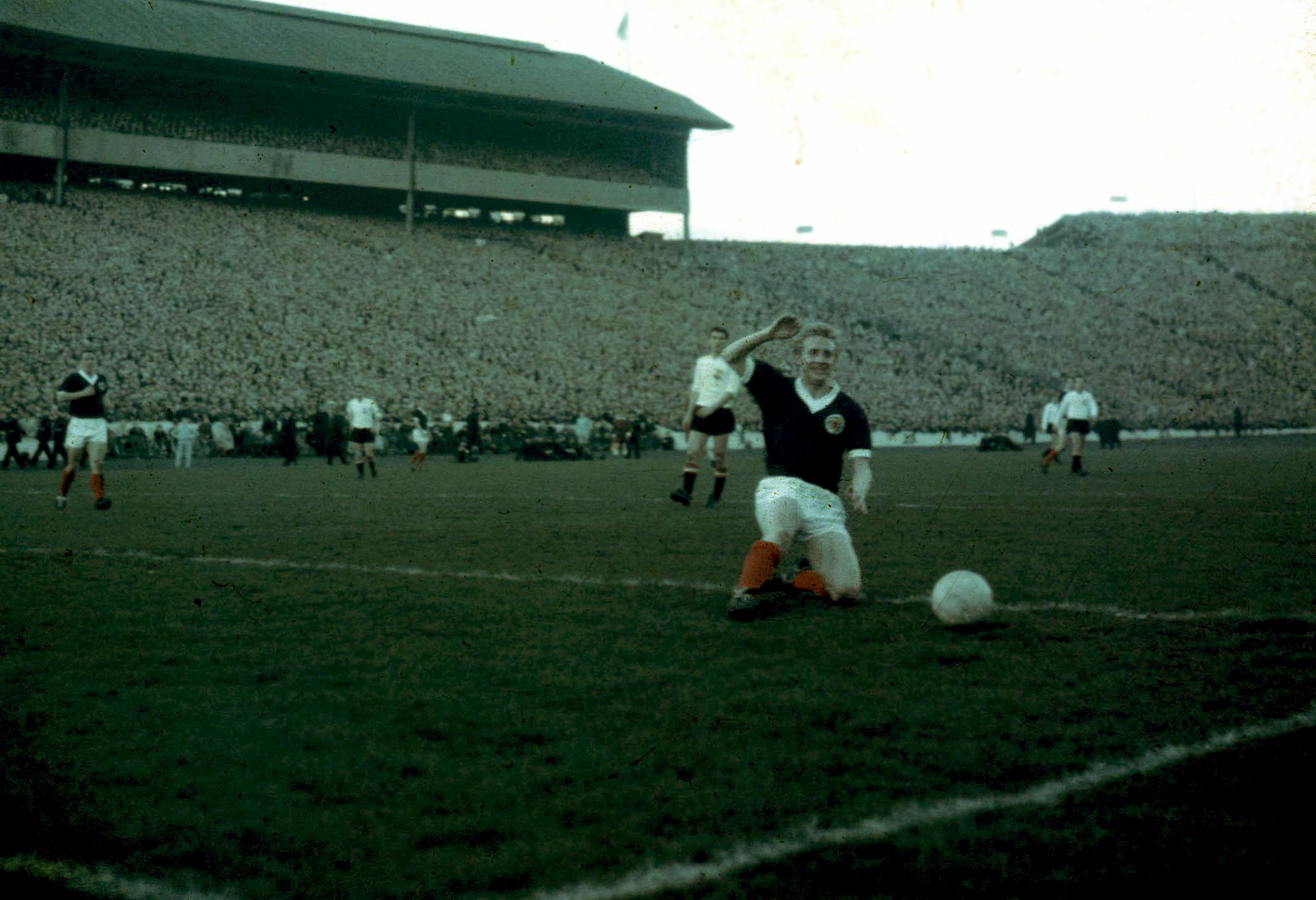 Denis Law plays in front of a packed house in 1965.