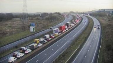 M8 road closed at rush hour after vehicle catches fire near Newhouse