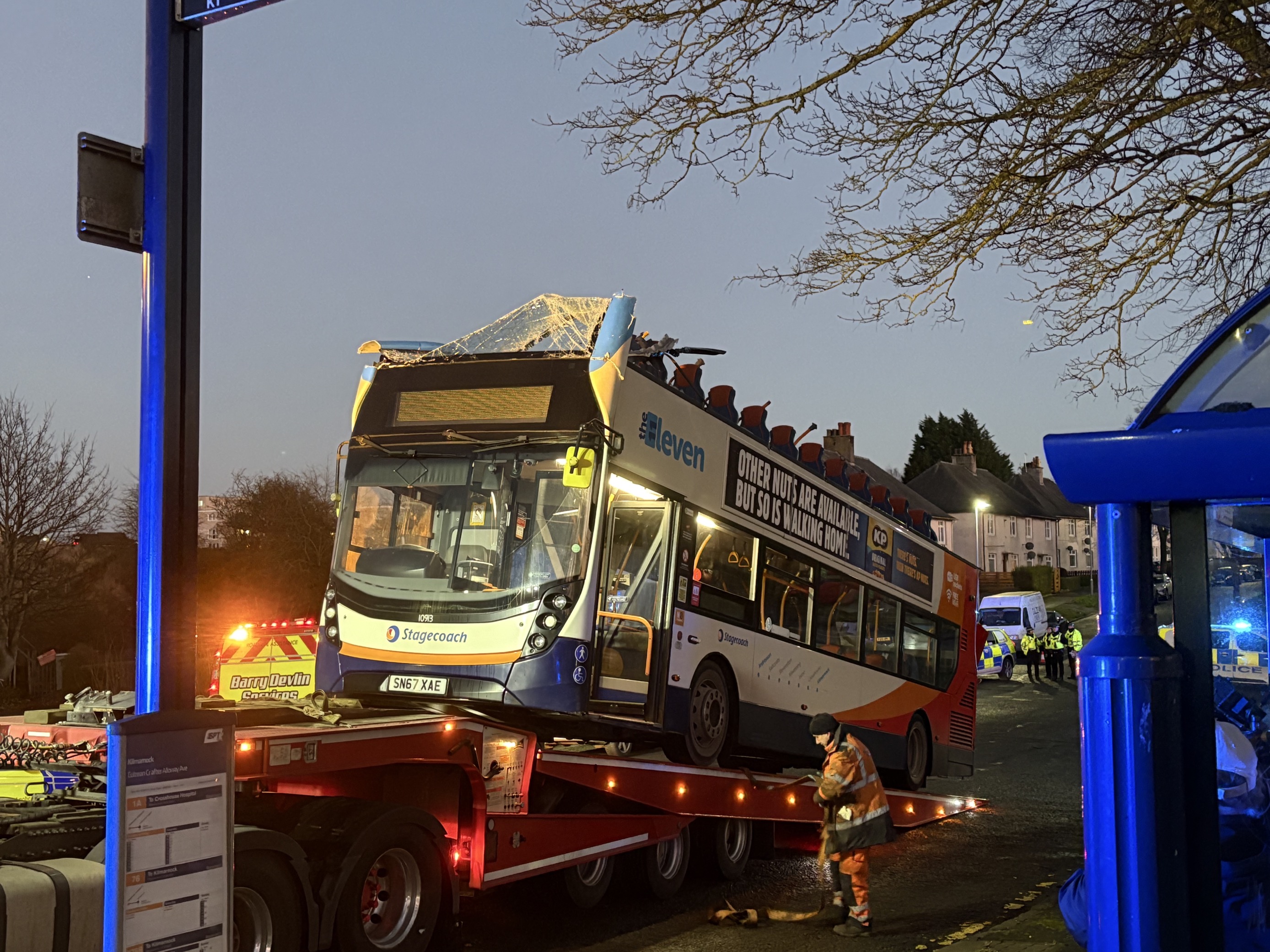 A double-decker bus has had its roof torn off after crashing into a railway bridge in East Ayrshire on December 19.