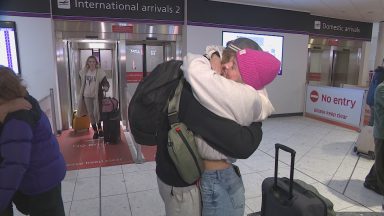 Families and loved ones reunite at Edinburgh Airport ahead of Christmas