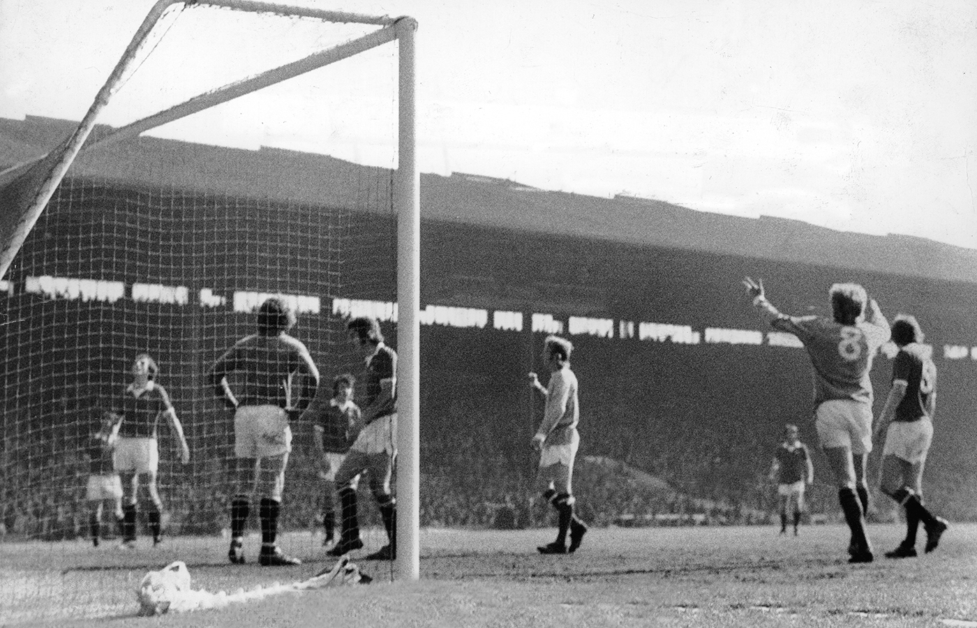 Denis Law stands expressionless, without celebration, after scoring for Manchester City against Manchester United - a goal that hammered the final nail in United's coffin and confirmed their relegation to Division Two on April 27, 1974. 