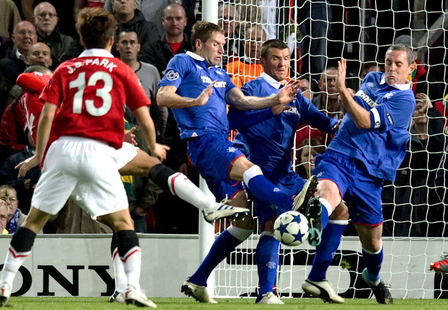 Rangers defended resolutely to take a point from Old Trafford in the Champions League. 