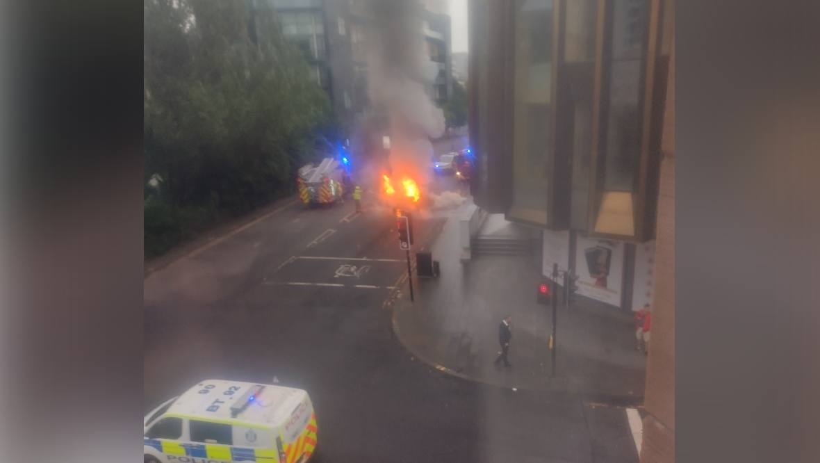 Three injured and car burst into flames after distracted driver crashed into bus in Glasgow