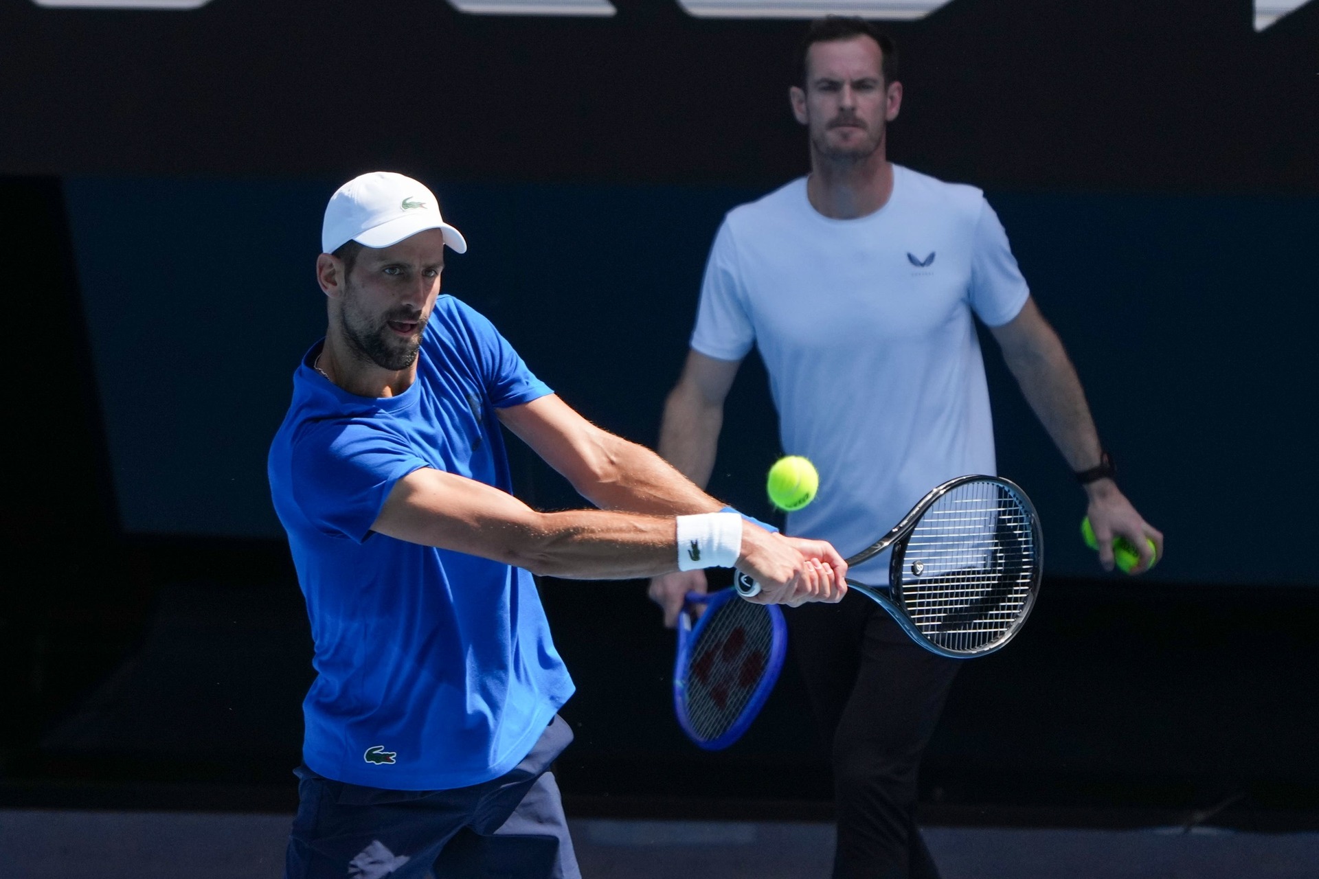 <em>Andy Murray, right, watches Novak Djokovic practise. (Mark Baker/AP)</em>”/><cite class=cite>PA Media</cite></div><figcaption aria-hidden=true><em>Andy Murray, right, watches Novak Djokovic practise. (Mark Baker/AP)</em> <cite class=hidden>PA Media</cite></figcaption></figure><p>Djokovic’s announcement that he would be working with Murray took the whole sporting world by surprise, and the Scot was equally shocked when the idea was first presented to him.</p><p>Murray said: “I was enjoying being away from the tour and I really hadn’t watched much tennis. I had not missed playing or competing or being on a tennis court at all.</p><p>“I was actually playing golf. We’d actually been exchanging messages. Novak had messaged me just wanting to chat.</p><p>“I was on the 17th hole of the golf course and the guy I was playing with said to me, ‘Do you know what’s next’? I was like, ‘No, not really’. He said ‘Do you have any plans to do any coaching’? And I said, ‘Honestly, I can’t think of anything worse to do right now’.</p><p>“And then 30 minutes later I was in the car and I called Novak, and then we had a conversation and he asked if I would be interested in helping, which I obviously wasn’t expecting.</p><p>“I said to him, ‘Look, I need to think about it and talk to my family.’ So I spoke to them and, after a couple of days, I thought that it was a pretty unique opportunity and experience.”</p><p>Murray has spent a lot of time on the golf course since his retirement following the Olympics last summer, while he also spoke about the desire to spend more time with his young family.</p><p>He was unable to join Djokovic at the warm-up tournament in Brisbane last week because of a family skiing holiday, but Murray insisted going back on the road had not caused marital tensions.</p><p>“My wife was very supportive of it,” he said. “I was actually going to be in Australia anyway for a few days during the tournament. She was surprised, obviously, that he’d asked me, but she was really supportive of it.”</p><figure class=