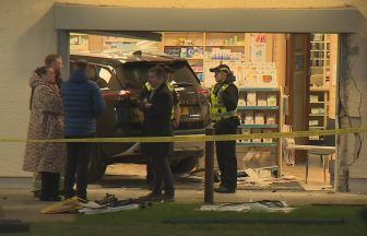 Woman in hospital after car crashes into pharmacy in Inverness