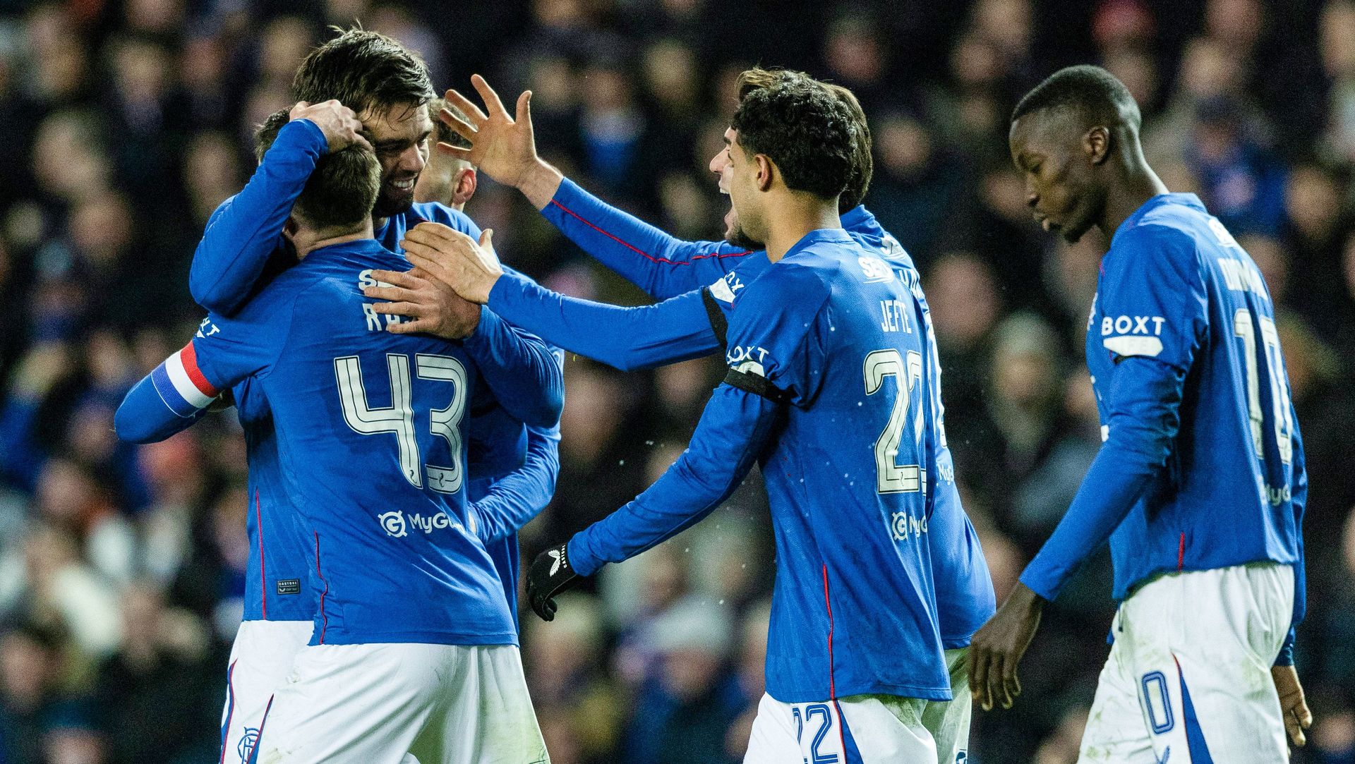 GLASGOW, SCOTLAND - JANUARY 02: Rangers' Robin Propper (L) celebrates making it 2-0 with his teammates during a William Hill Premiership match between Rangers and Celtic at Ibrox Stadium, on January 02, 2025, in Glasgow, Scotland.  (Photo by Craig Foy / SNS Group)