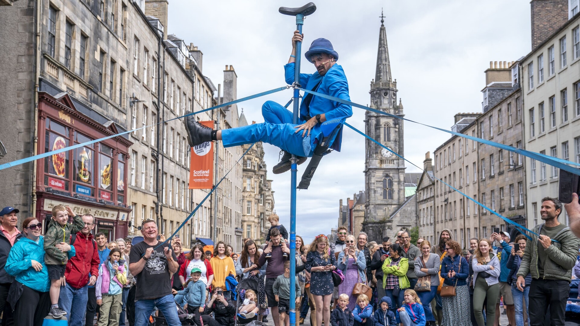 A street performer entertains the crowds on Edinburgh’s Royal Mile as part of the Fringe