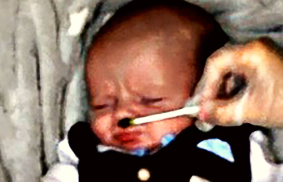 A baby making a cry face in response to kale odour. The three-week-old baby made a 