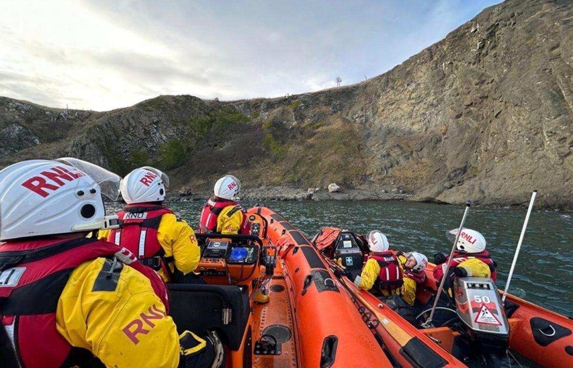 Woman rescued after becoming stuck on cliff above sea