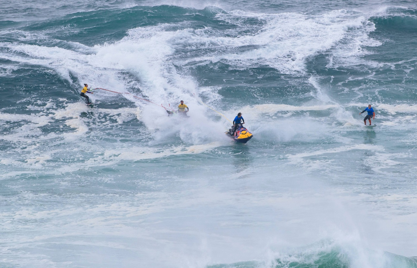 Ben Larg towing teammate Andrew Cotton into wave at Nazare.