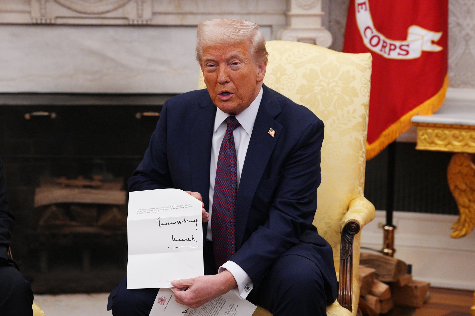 US President Donald Trump is presented with a letter from King Charles III, who invited him for an unprecedented second state visit