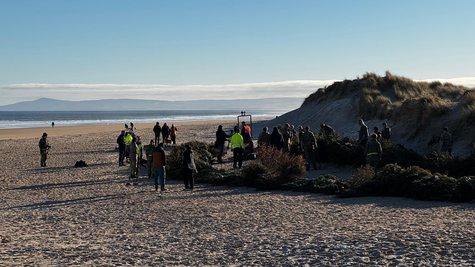 Community members and RAF troops rallied together to help with the town's very first dune restoration project.