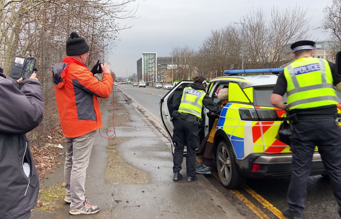 A 74-year-old woman was arrested and charged in connection with breach of the exclusion zone on Hardgate Road