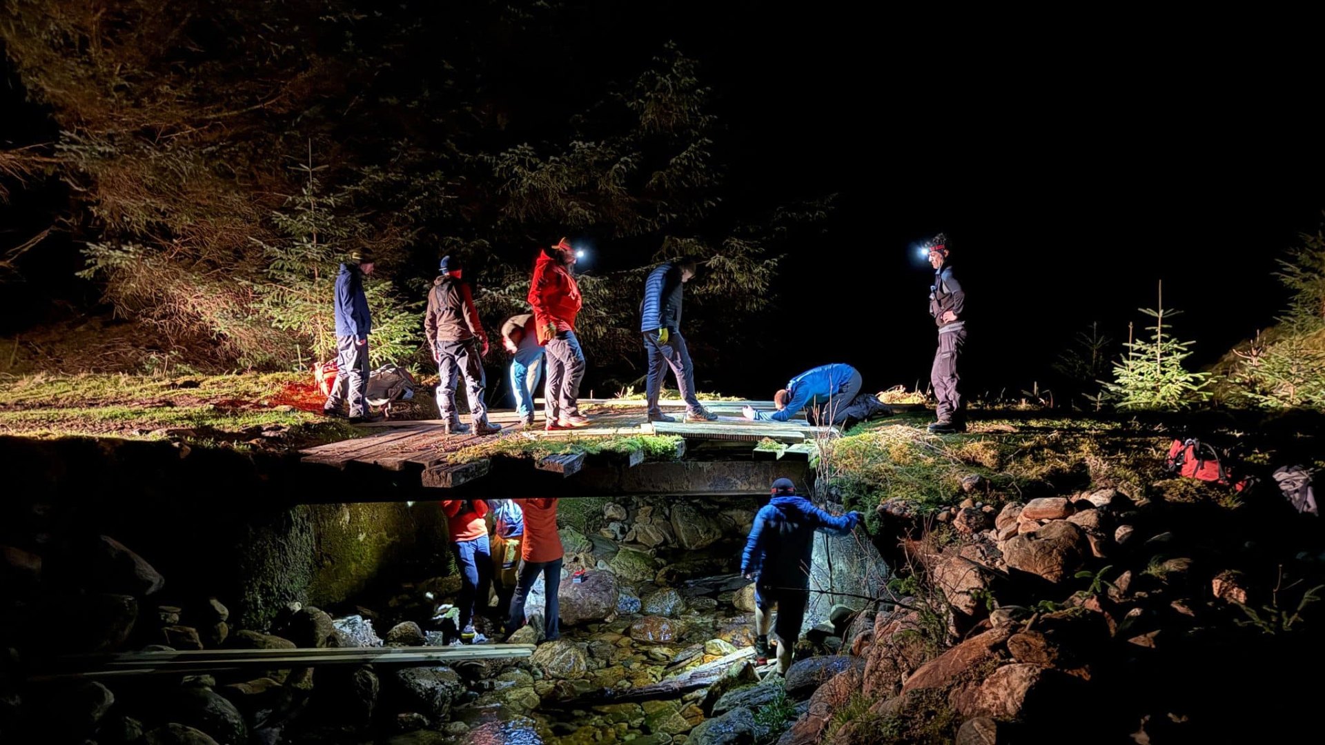 The mountain rescue team had to repair bridges en route to the dog.