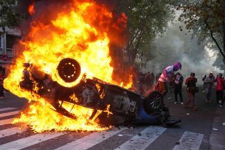 Argentine retirees and soccer fans clash with police during protests