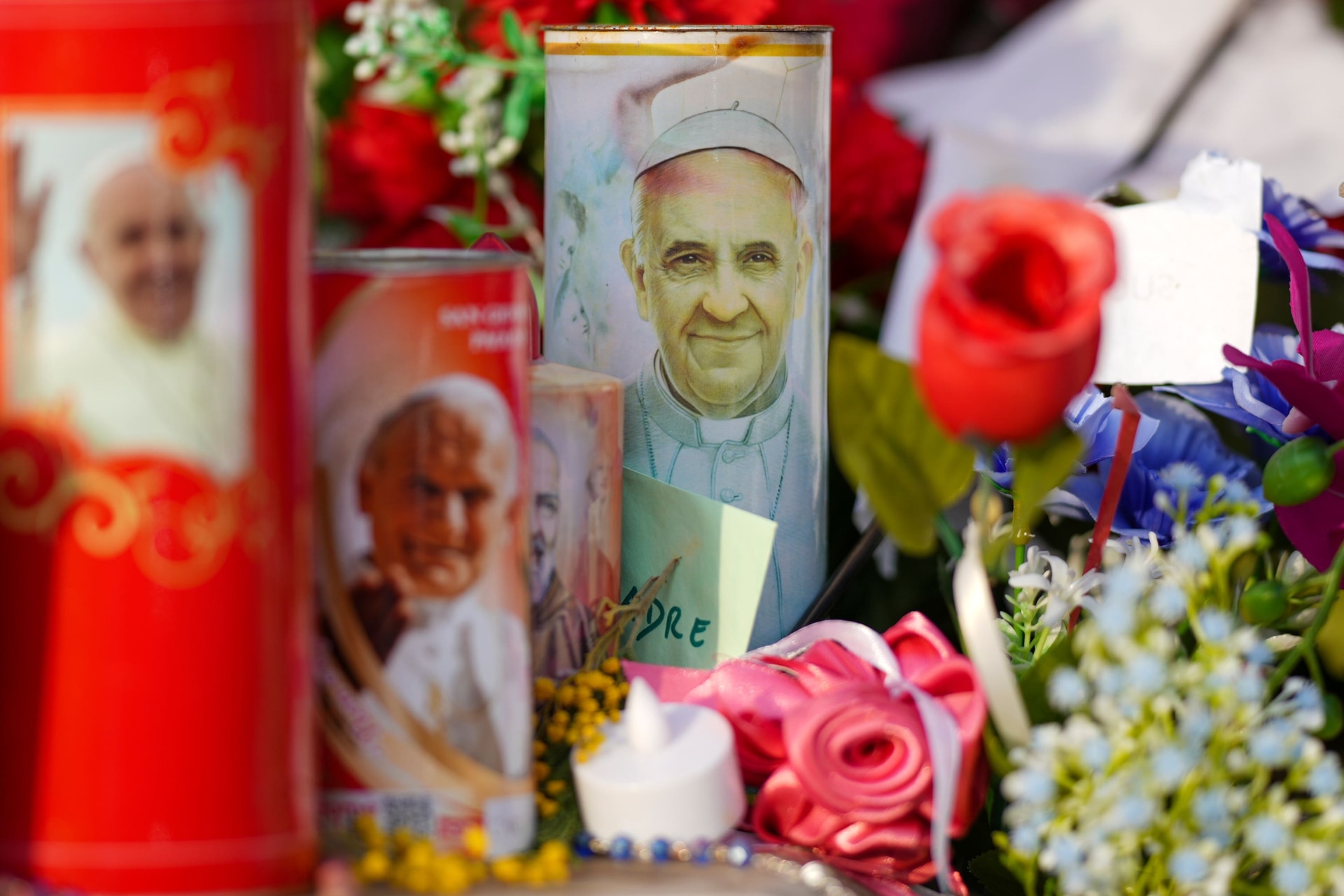 Candles and flowers for Pope Francis (Andrew Medichini/AP).