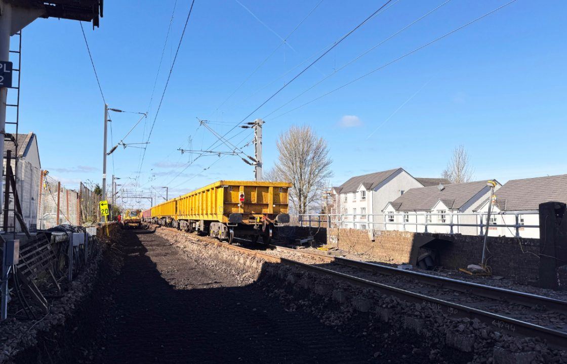 Rail worker taken to hospital after crane collapses onto railway line in Port Glasgow